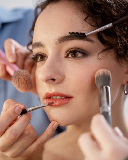 Makeup artist perfecting a bridal look